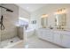 Gorgeous bathroom featuring a soaking tub, walk-in shower and double sink vanity at 8604 Herons Cove Pl, Tampa, FL 33647