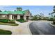 Beautiful community clubhouse with well-maintained landscaping and visible waterpark with slide, perfect for Gathering recreation at 8604 Herons Cove Pl, Tampa, FL 33647
