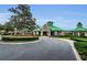 Charming community clubhouse with landscaped grounds and a welcoming entrance, offering residents a central gathering space at 8604 Herons Cove Pl, Tampa, FL 33647