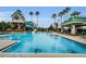 Stunning community pool area with water slide, comfortable lounge chairs, and shaded areas, offering a resort-like experience at 8604 Herons Cove Pl, Tampa, FL 33647