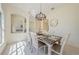 Elegant dining area with a modern chandelier, setting the stage for memorable meals and gatherings at 8604 Herons Cove Pl, Tampa, FL 33647