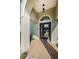 Beautiful front entryway with a decorative glass door, brick tile, and a hanging light fixture at 8604 Herons Cove Pl, Tampa, FL 33647