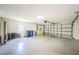 Spacious two-car garage with a door to the exterior at 8604 Herons Cove Pl, Tampa, FL 33647