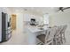 Spacious kitchen features a large island with seating, stainless steel appliances, and white cabinetry at 8604 Herons Cove Pl, Tampa, FL 33647