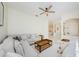 Inviting living room with neutral-toned furniture, a sectional sofa, and view into the open kitchen at 8604 Herons Cove Pl, Tampa, FL 33647