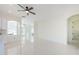 Open concept living area with abundant natural light and smooth tile flooring at 8604 Herons Cove Pl, Tampa, FL 33647