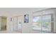 Bright room with sliding glass doors leading to a screened-in patio at 8604 Herons Cove Pl, Tampa, FL 33647