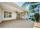Spacious screened patio with ceiling fan, offering seamless indoor-outdoor living at 8604 Herons Cove Pl, Tampa, FL 33647
