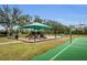 Community playground with slides, swings, and a basketball court, perfect for Gathering activities at 8604 Herons Cove Pl, Tampa, FL 33647
