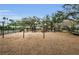 Community playground with swings, climbing structures, and a wood chip surface at 8604 Herons Cove Pl, Tampa, FL 33647