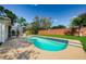 Inviting backyard pool with tile accents and a spacious patio area, perfect for summer fun at 8604 Herons Cove Pl, Tampa, FL 33647