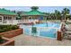 Fun splash pad area with colorful water features, surrounded by fencing, providing a safe and enjoyable space for children at 8604 Herons Cove Pl, Tampa, FL 33647