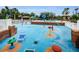 Community splash pad with colorful play features, seating, and easy access to the pool and clubhouse at 8604 Herons Cove Pl, Tampa, FL 33647