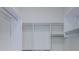 Spacious walk-in closet featuring shelving and hanging rods at 8604 Herons Cove Pl, Tampa, FL 33647