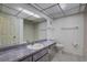 This bathroom features a single sink, large mirror, and a toilet at 8990 Antigua Dr, Seminole, FL 33777