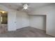Carpeted bedroom with double closets, ceiling fan, and neutral walls at 8990 Antigua Dr, Seminole, FL 33777