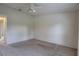 This bedroom is carpeted and has a ceiling fan installed at 8990 Antigua Dr, Seminole, FL 33777