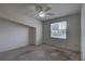 Bedroom featuring a ceiling fan, neutral walls, carpeting and a window letting in natural light at 8990 Antigua Dr, Seminole, FL 33777