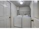 A tidy laundry room offers convenience with its washer and dryer at 8990 Antigua Dr, Seminole, FL 33777