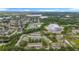 Panoramic aerial view of a residential community with lakes and lush greenery providing serene natural beauty at 22706 Gage Loop # 31, Land O Lakes, FL 34639