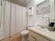 Bathroom featuring a toilet, sink, tub, shower, and white accents at 22706 Gage Loop # 31, Land O Lakes, FL 34639