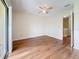 Bright bedroom featuring hardwood floors and sliding glass doors at 22706 Gage Loop # 31, Land O Lakes, FL 34639