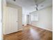 Bedroom with light wood floors, a ceiling fan, and a double closet at 22706 Gage Loop # 31, Land O Lakes, FL 34639