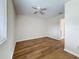Bedroom with light wood floors and a ceiling fan at 22706 Gage Loop # 31, Land O Lakes, FL 34639