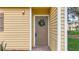 Charming front door with a decorative wreath, set in a cozy, inviting entryway at 22706 Gage Loop # 31, Land O Lakes, FL 34639