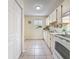 Cozy kitchen featuring a window, neutral color palette, and efficient layout, maximizing functionality at 22706 Gage Loop # 31, Land O Lakes, FL 34639