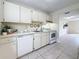 Functional kitchen with ample counter space and white cabinets, offering a bright and clean cooking environment at 22706 Gage Loop # 31, Land O Lakes, FL 34639