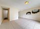 Inviting living room with neutral walls and tile flooring, seamlessly connecting to other living spaces in the home at 22706 Gage Loop # 31, Land O Lakes, FL 34639