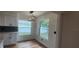 Bright dining area with wood floors and contemporary lighting at 1027 Fountainhead Dr, Largo, FL 33770