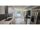 Stylish modern kitchen with stainless steel appliances, sleek counters, and herringbone backsplash at 1027 Fountainhead Dr, Largo, FL 33770