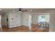 Bright living room features sleek flooring and a modern ceiling fan and dining area at 1027 Fountainhead Dr, Largo, FL 33770
