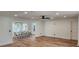 Spacious living and dining area with recessed lighting, a modern ceiling fan, and wood flooring at 1027 Fountainhead Dr, Largo, FL 33770