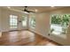 Sun-filled room with multiple windows and access to the yard at 1027 Fountainhead Dr, Largo, FL 33770