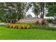 Wyndtree community entrance sign surrounded by lush landscaping and mature trees on a well-manicured lawn at 1046 Middlesex Dr, New Port Richey, FL 34655