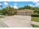 A two-car garage, driveway, and well-maintained landscaping enhance the home's curb appeal at 1046 Middlesex Dr, New Port Richey, FL 34655