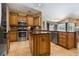 Well-equipped kitchen featuring stainless steel appliances, granite countertops, and a convenient center island at 1046 Middlesex Dr, New Port Richey, FL 34655