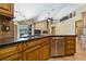 Gourmet kitchen featuring granite countertops, stainless steel appliances, and ample storage at 1046 Middlesex Dr, New Port Richey, FL 34655
