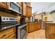 Modern kitchen features stainless steel appliances, granite countertops, and stylish cabinetry at 1046 Middlesex Dr, New Port Richey, FL 34655