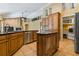 Well-equipped kitchen with stainless steel appliances, granite countertops, and custom wood cabinetry at 1046 Middlesex Dr, New Port Richey, FL 34655