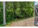 Green landscaping shows off the natural beauty surrounding the home at 1046 Middlesex Dr, New Port Richey, FL 34655