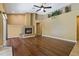 Spacious living room featuring a cozy fireplace, wood floors, and neutral decor at 1046 Middlesex Dr, New Port Richey, FL 34655