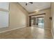 Open concept living room with vaulted ceilings and sliding glass doors to the pool area at 1046 Middlesex Dr, New Port Richey, FL 34655