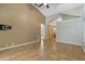Open living room featuring tile floors, vaulted ceilings and neutral paint at 1046 Middlesex Dr, New Port Richey, FL 34655