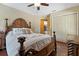 Comfortable main bedroom with a decorative wooden bed frame and hardwood floors at 1046 Middlesex Dr, New Port Richey, FL 34655