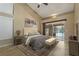 Serene main bedroom featuring a sliding door to the lanai and pool, neutral decor, and tile flooring at 1046 Middlesex Dr, New Port Richey, FL 34655