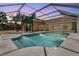Beautiful screened-in pool area with ample space for lounging and enjoying the Florida sunshine at 1046 Middlesex Dr, New Port Richey, FL 34655